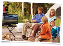 Photograph showing the Camper's Dream Pack being used outdoors including the Winegard Carryout